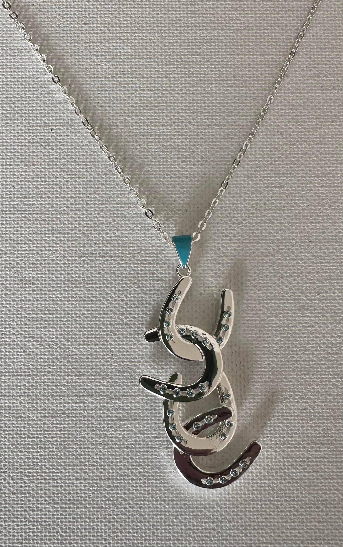 Four horseshoe necklace