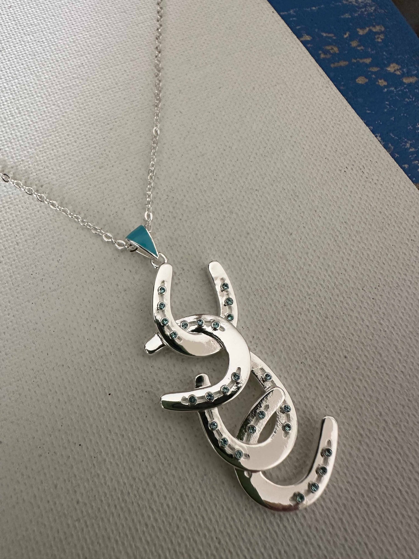 Four horseshoe necklace